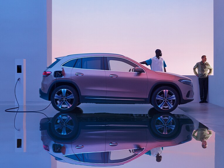 The EQA from Mercedes-EQ being charged at a roadside charging station.
