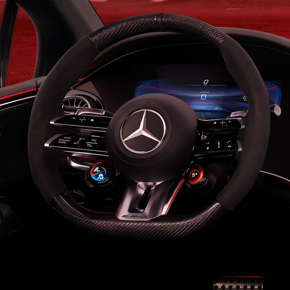 The AMG steering wheel buttons in the interior of the Mercedes-AMG EQE Saloon.