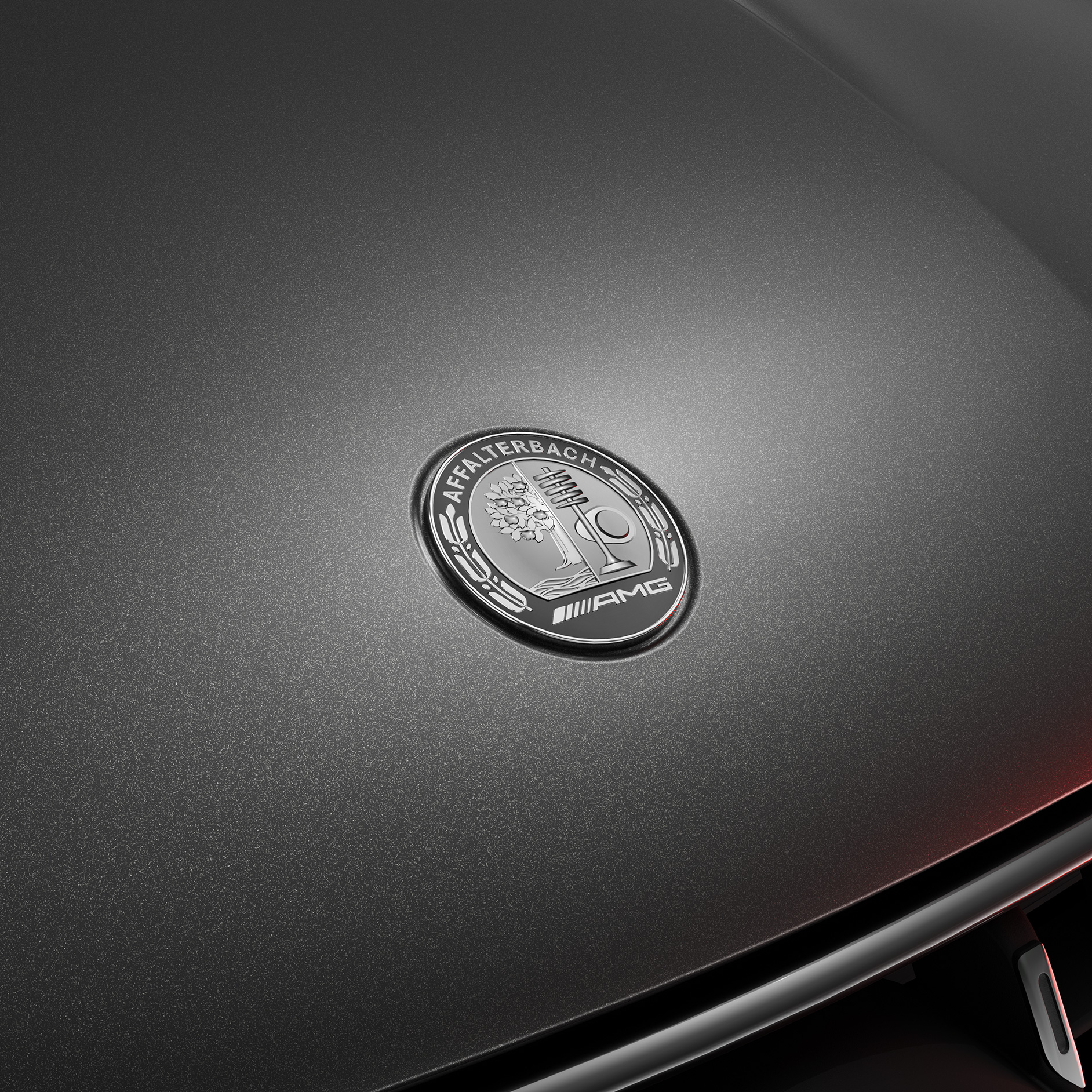 AMG Private Lounge | Mercedes-AMG The AMG crest on the front of a Mercedes-AMG model.