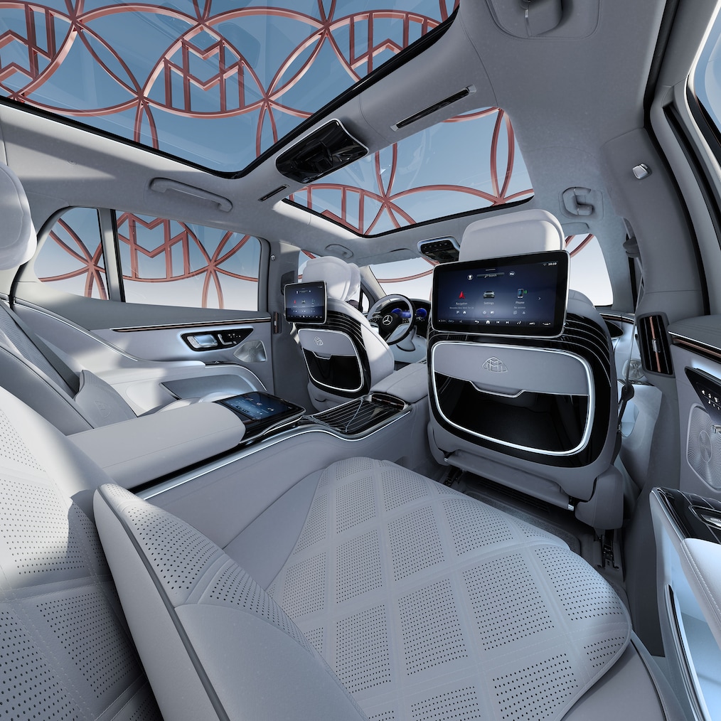 View through the open door on the passenger side into the spacious and comfortable rear.