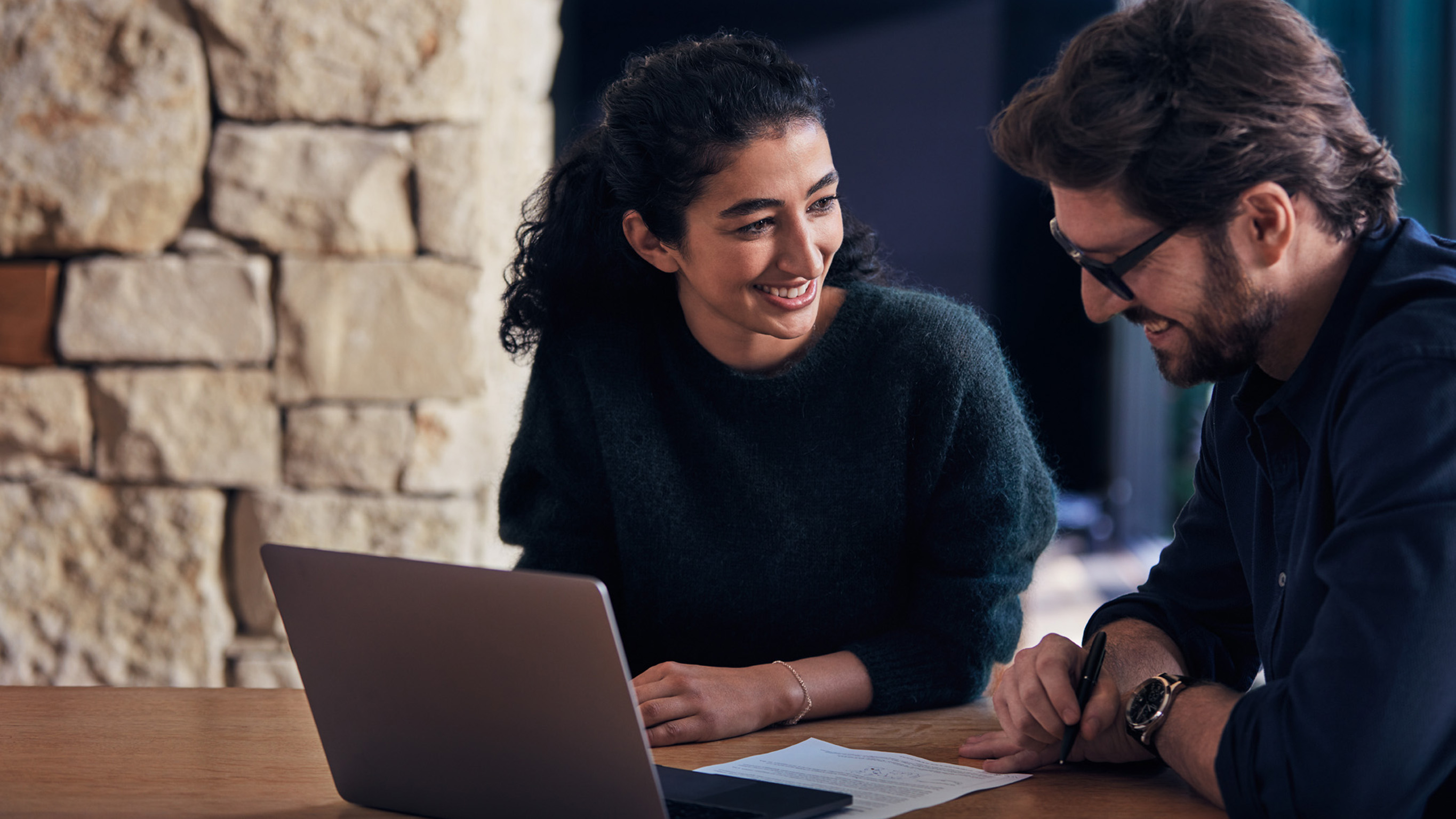 couple looking at Mercedes-Benz website on a laptop Picture shows couple looking at Mercedes-Benz website on a laptop