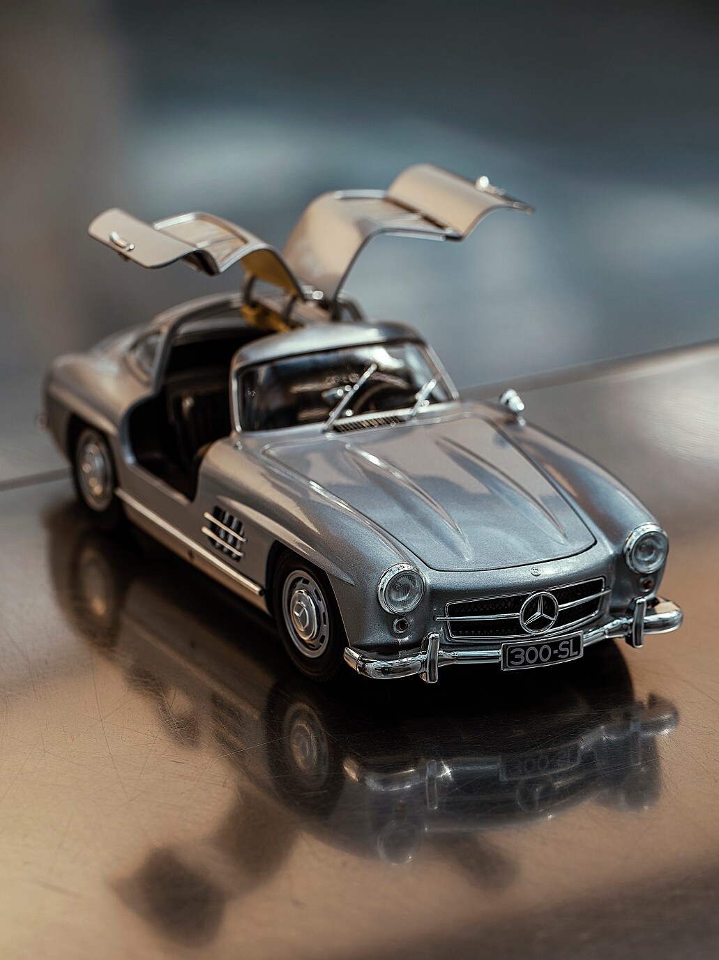 The open gullwing doors of the classic 300 SL model reveal a passion for detail.