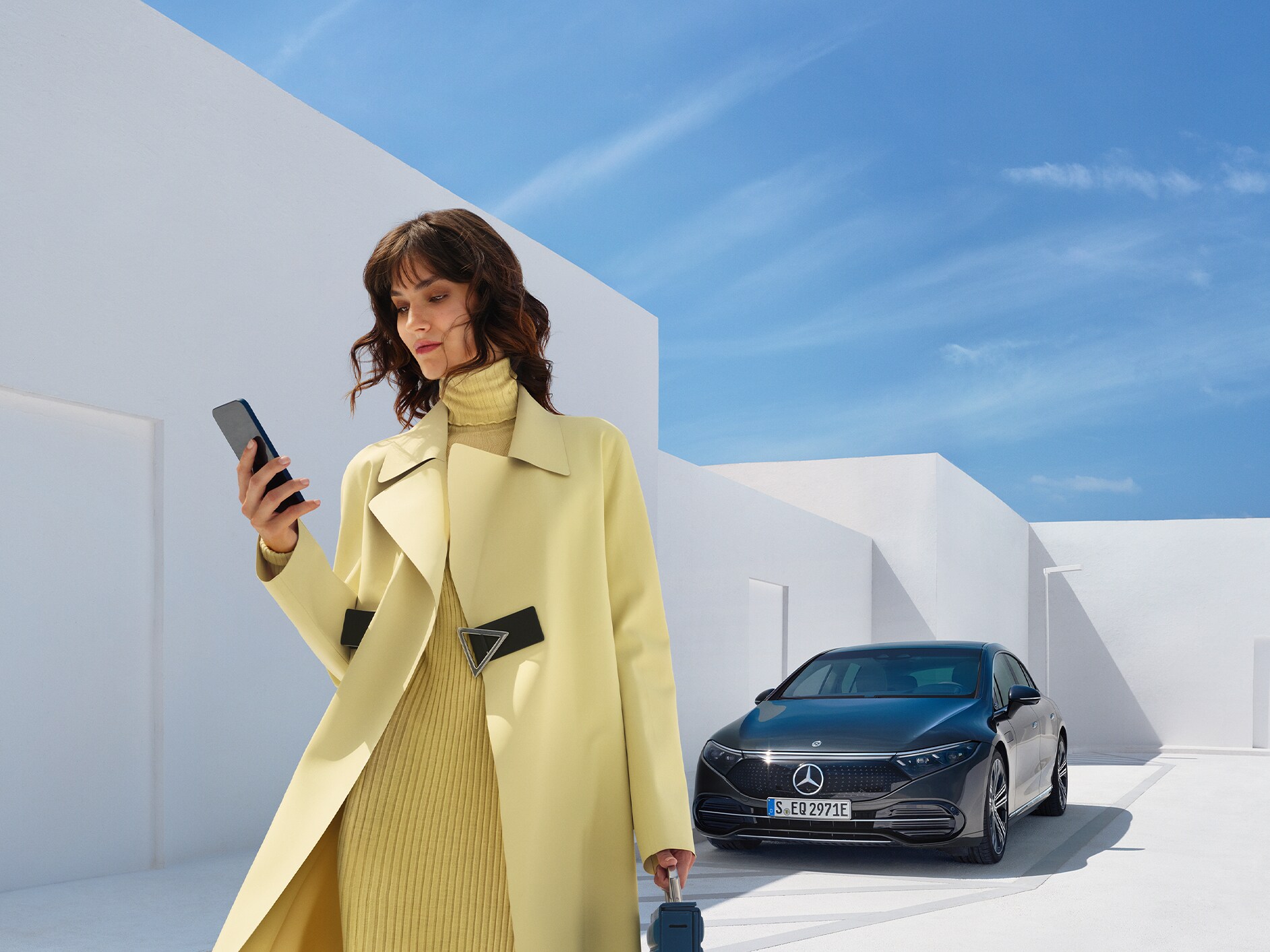 Person extending/purchasing Digital Extras for a vehicle using a smartphone.