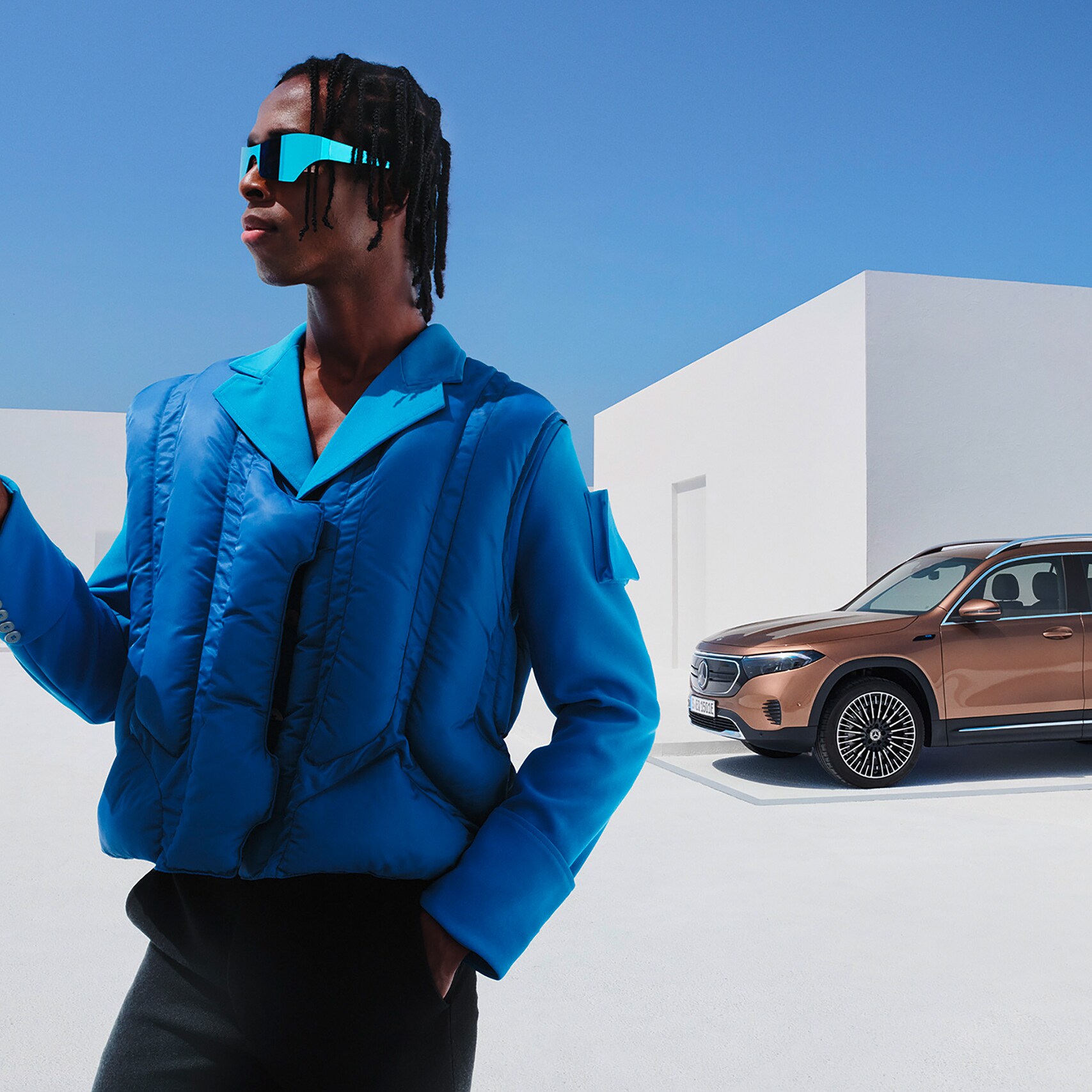 Man checking the status of his vehicle on his smartphone in a Mercedes app.
