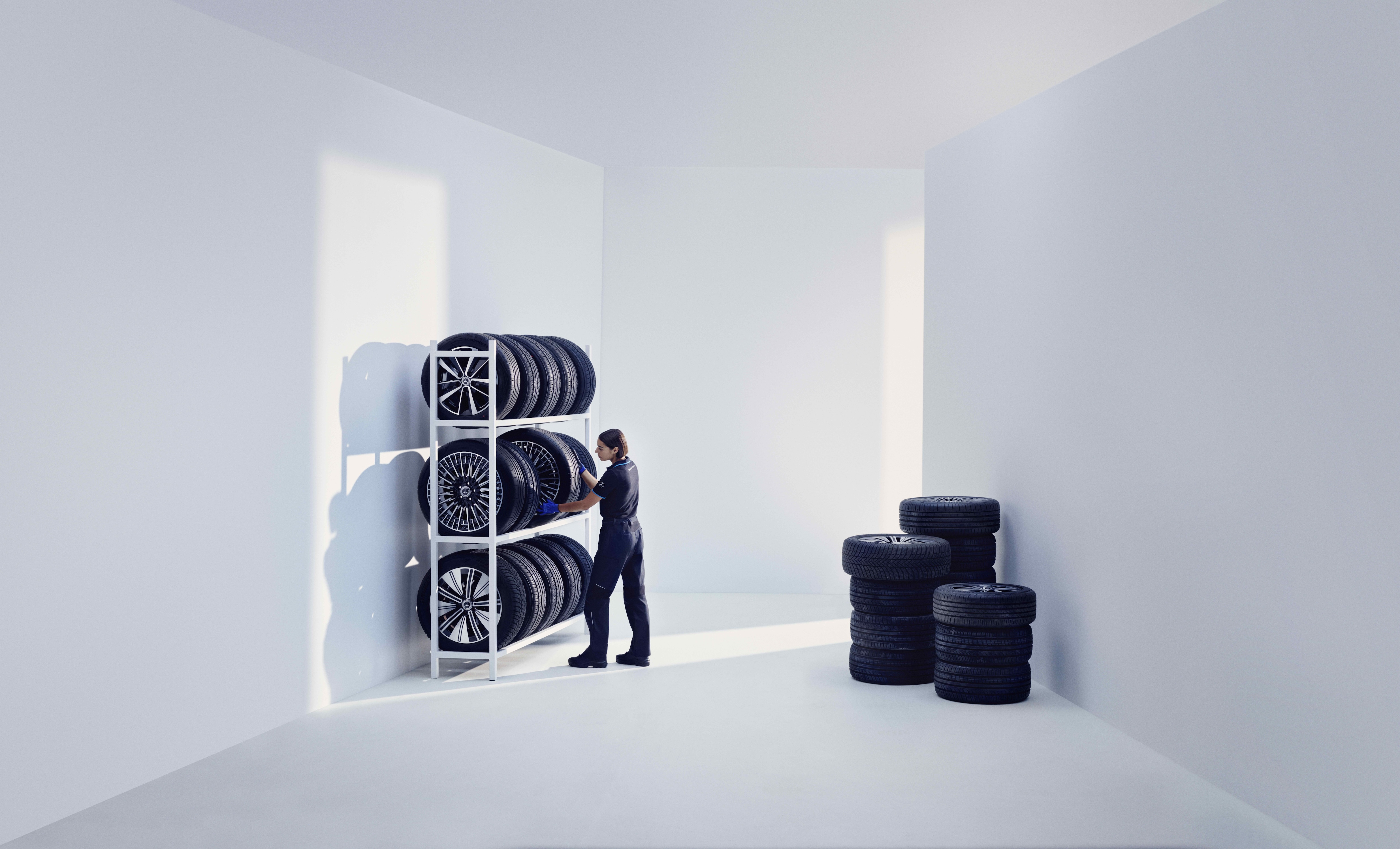 Original Tyres | Mercedes-Benz A Mercedes-Benz technician stores Mercedes-Benz Original tires on a shelf.