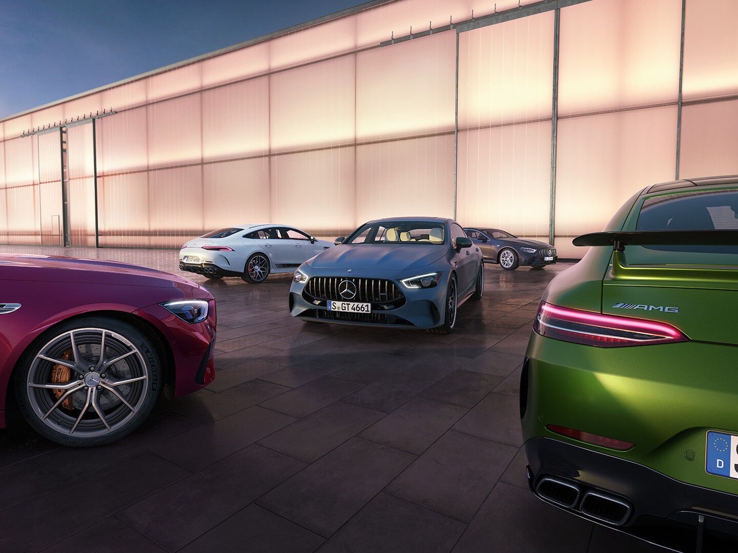 Mercedes-AMG models Mercedes-AMG vehicles on a race track.