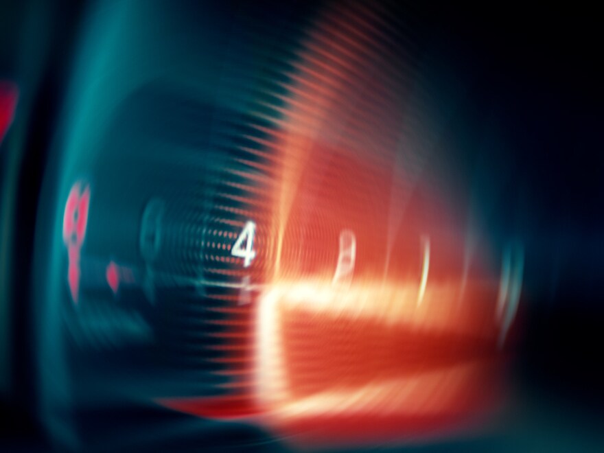 Stylized image of an AMG vehicle in turquoise and red.