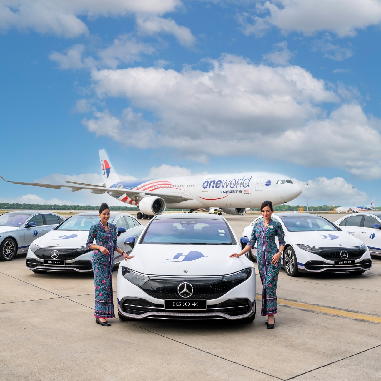 Picture shows Mercedes-Benz cars line-up in front of an aeroplane