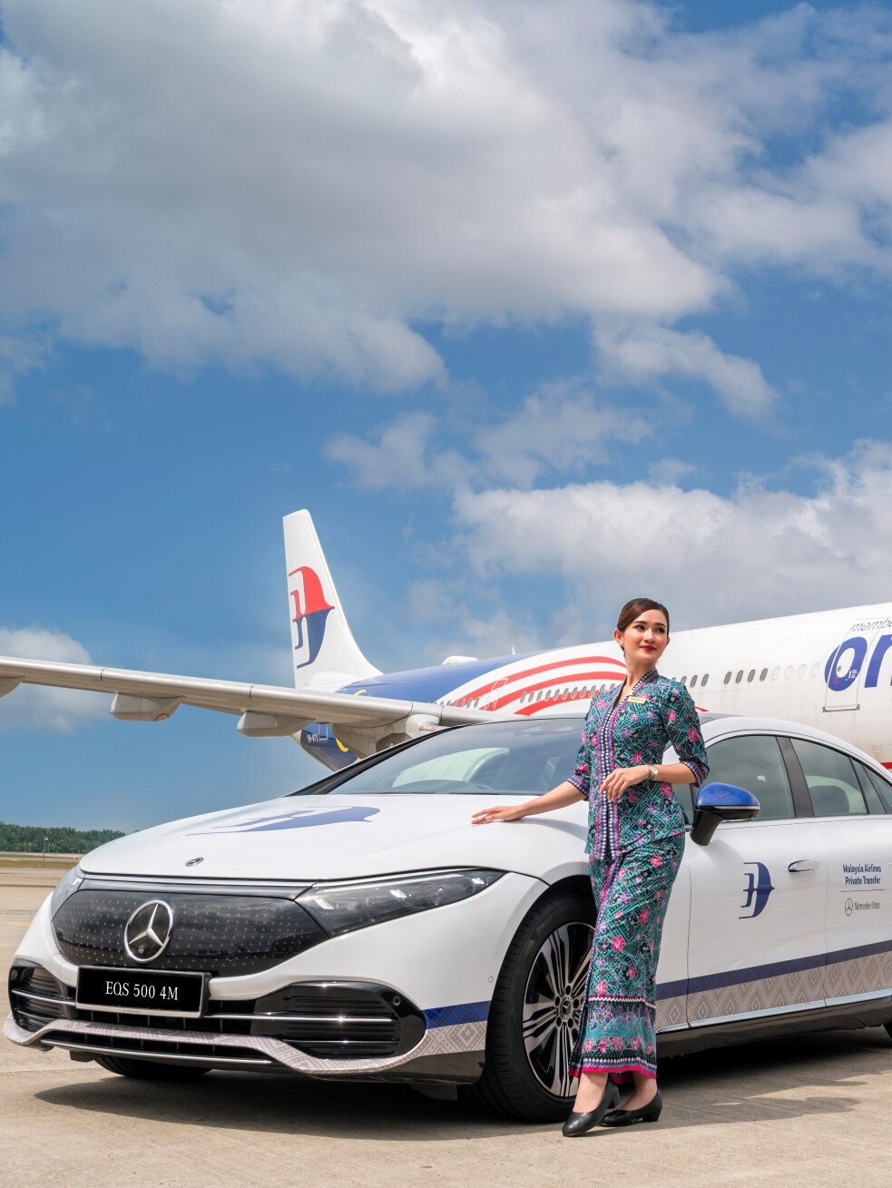 Picture shows Mercedes-Benz cars line-up in front of an aeroplane