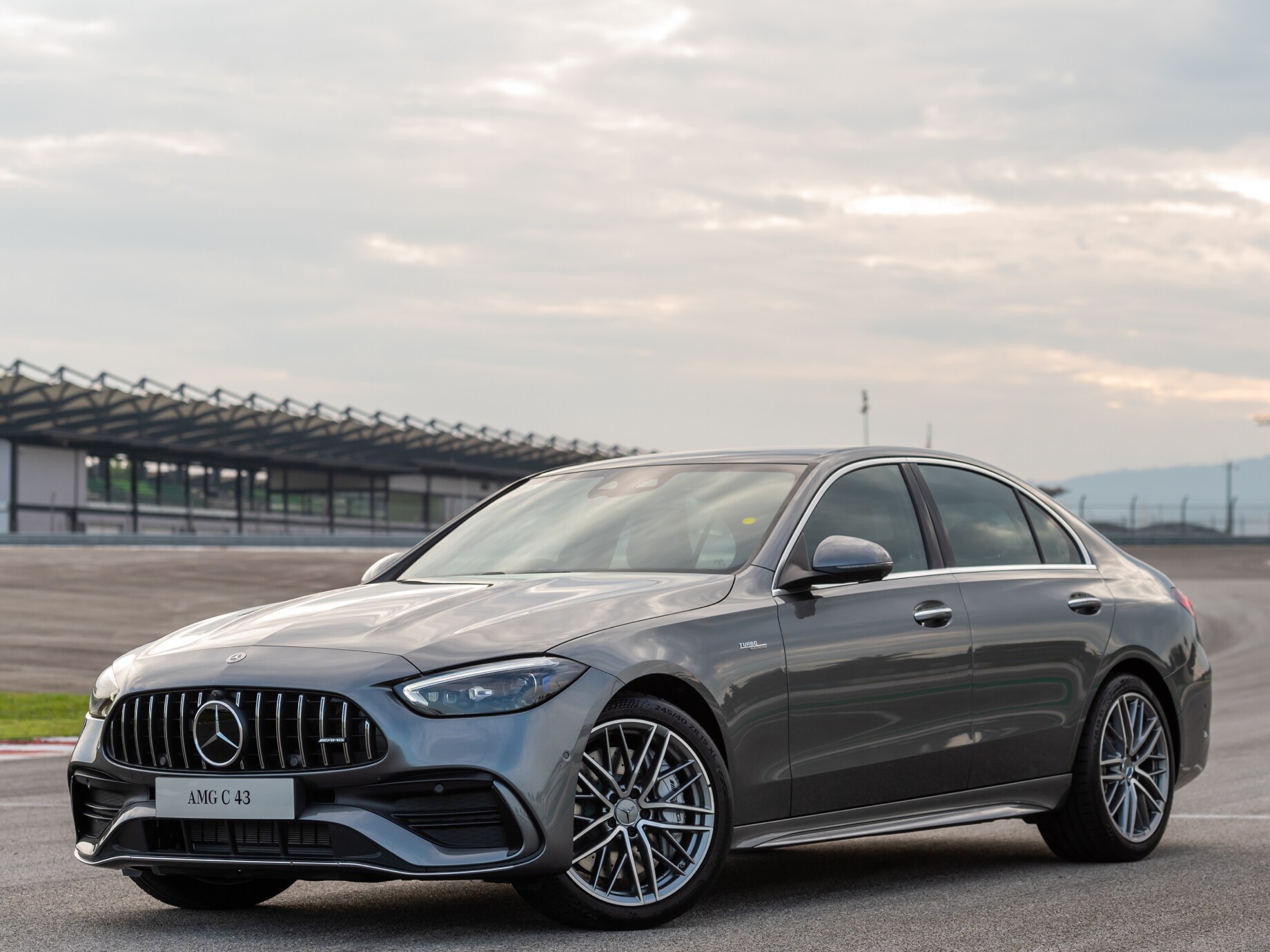 Front side image of the Mercedes-AMG C 43 4MATIC on a race track