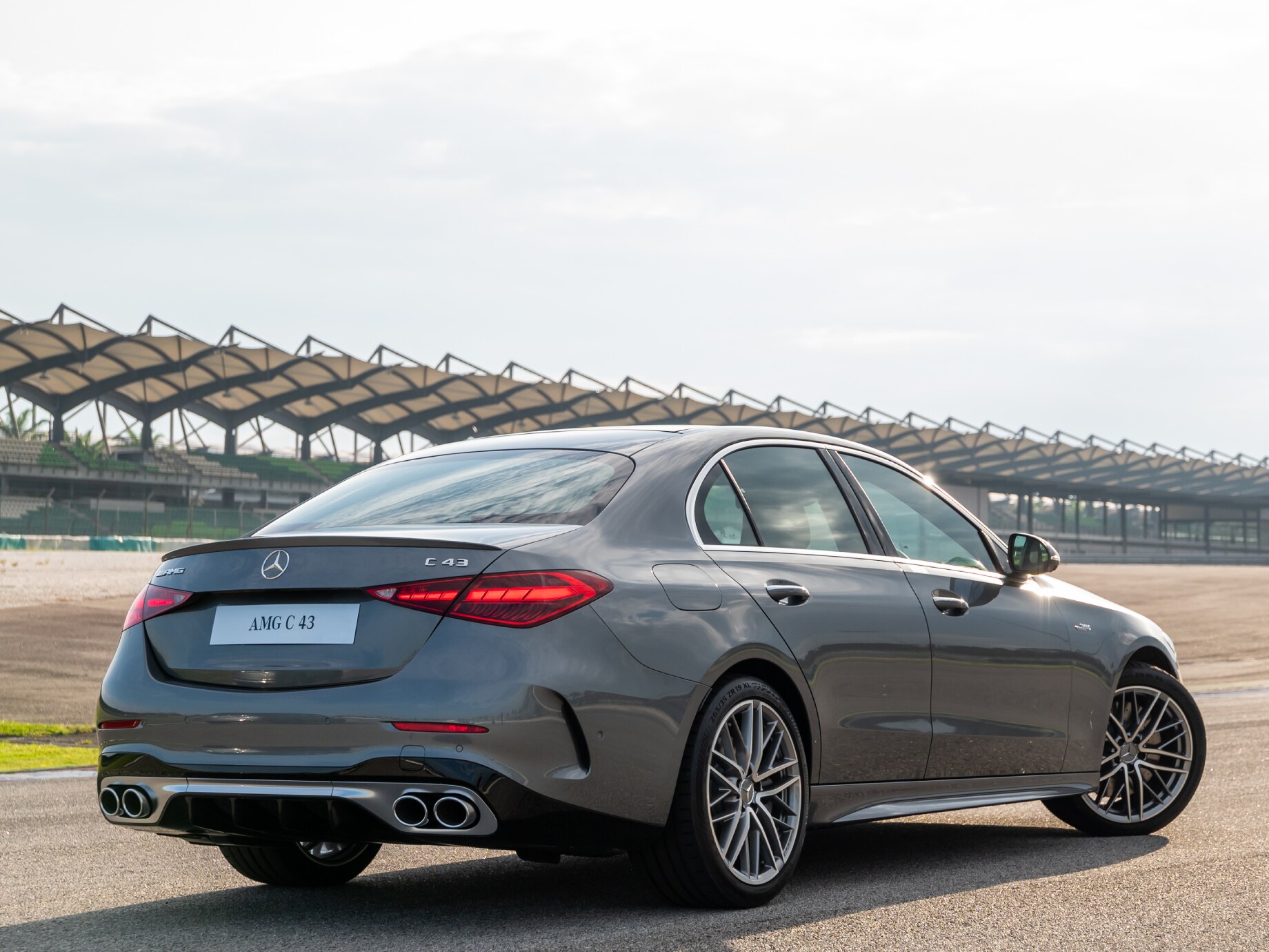 Rear side image of the Mercedes-AMG C 43 4MATIC on a race track